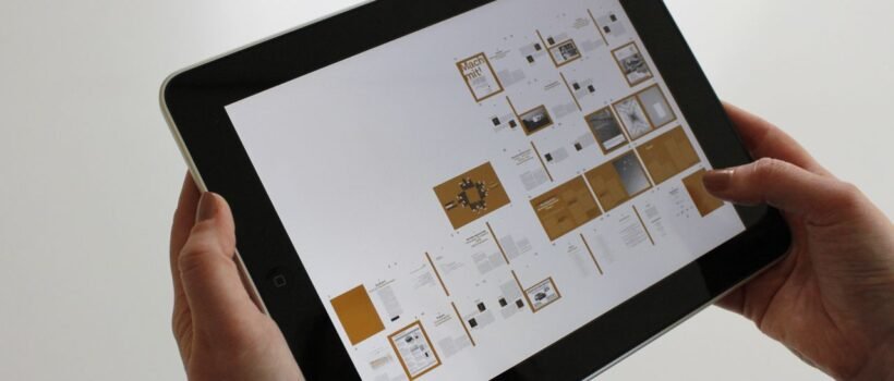 Close-up of hands using a tablet, displaying a digital interface.