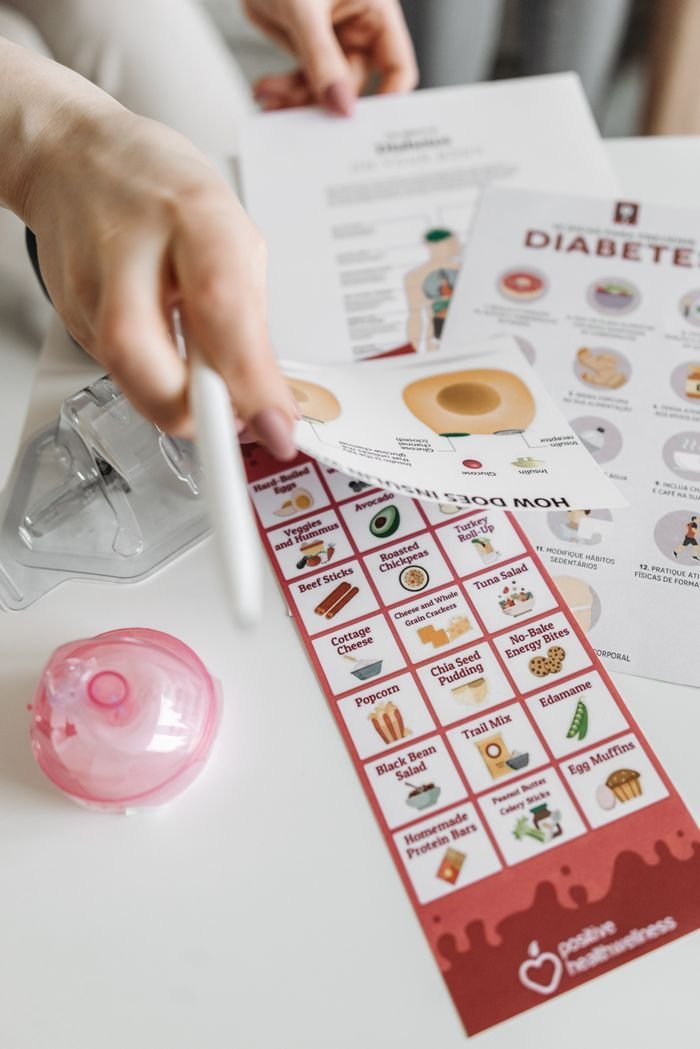 Informative diabetes pamphlets and dietary guide with hand interaction.